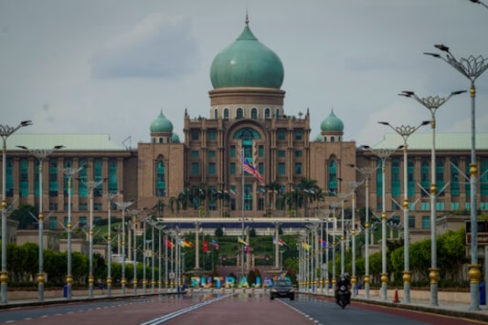 Motorists drive in front of the prime minister's office building in Putrajaya, Malaysia, Friday, Oct. 23, 2020. Malaysian opposition leader Anwar Ibrahim said Friday he was concerned about reports that Prime Minister Muhyiddin Yassi may invoke emergency laws to suspend Parliament and stymie bids to oust his government. (AP Photo/Vincent Thian) Motorists drive in front of the prime minister's office building in Putrajaya, Malaysia, Friday, Oct. 23, 2020. Malaysian opposition leader Anwar Ibrahim said Friday he was concerned about reports that Prime Minister Muhyiddin Yassi may invoke emergency laws to suspend Parliament and stymie bids to oust his government. (AP Photo/Vincent Thian)