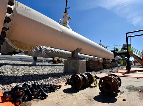 FILE - In this June 8, 2017, file photo, fresh nuts, bolts and fittings are ready to be added to the east leg of the pipeline near St. Ignace, Mich., as Enbridge prepares to test the east and west sides of the Line 5 pipeline under the Straits of Mackinac in Mackinaw City, Mich. The Michigan Public Service Commission has some authority over Enbridge's plans to build an oil pipeline tunnel beneath the channel that connects two of the Great Lakes, a state administrative law judge ruled Friday, Oct. 23, 2020. (Dale G Young/Detroit News via AP, File)