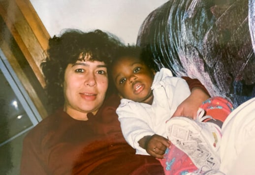 Mexican-born Patricia Palafox, left, holds her American-born daughter, Sarah, in Zacatecas, Mexico, in this updated photo. Sarah Palafox, now 23, is gaining attention as an African American woman who sings regional Mexican music. The 23-year-old has sparked many emotions following a series of viral video performances on social media. (Silent Giant Entertainment via AP) Mexican-born Patricia Palafox, left, holds her American-born daughter, Sarah, in Zacatecas, Mexico, in this updated photo. Sarah Palafox, now 23, is gaining attention as an African American woman who sings regional Mexican music. The 23-year-old has sparked many emotions following a series of viral video performances on social media. (Silent Giant Entertainment via AP)