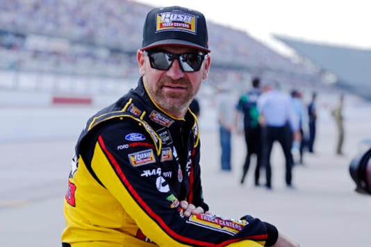 FILE - In this Aug. 31, 2019, file photo, Clint Bowyer waits on pit road for his turn to qualify for the NASCAR Cup Series auto race at Darlington Raceway in Darlington, S.C. wyer, popular among his peers and a beloved by fans, would have preferred a proper send-off in his final year as a NASCAR driver. Instead, hell settle for a farewell party Sunday at Kansas Speedway. Bowyer is retiring from racing at the end of this season and move into the Fox Sports booth. (AP Photo/Terry Renna, File) FILE - In this Aug. 31, 2019, file photo, Clint Bowyer waits on pit road for his turn to qualify for the NASCAR Cup Series auto race at Darlington Raceway in Darlington, S.C. wyer, popular among his peers and a beloved by fans, would have preferred a proper send-off in his final year as a NASCAR driver. Instead, hell settle for a farewell party Sunday at Kansas Speedway. Bowyer is retiring from racing at the end of this season and move into the Fox Sports booth. (AP Photo/Terry Renna, File)