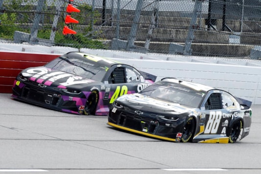 FILE  - In this Sunday, May 17, 2020, file photo, Jimmie Johnson (48) and Alex Bowman (88) come down a straightaway during a NASCAR Cup Series auto race in Darlington, S.C. The most coveted seat in NASCAR went to Alex Bowman in a Hendrick Motorsports lineup shuffle to replace seven-time champion Jimmie Johnson in the iconic No. 48 Chevrolet. Bowman and crew chief Greg Ives will move from the No. 88 into Johnson's ride at the end of the season. The swap announced Tuesday, Oct. 6, 2020, makes Bowman just the second driver of the team created in 2001 specifically for Johnson.(AP Photo/Brynn Anderson, File