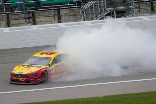 Joey Logano celebrates after winning a NASCAR Cup Series auto race at Kansas Speedway in Kansas City, Kan., Sunday, Oct. 18, 2020. (AP Photo/Orlin Wagner) Joey Logano celebrates after winning a NASCAR Cup Series auto race at Kansas Speedway in Kansas City, Kan., Sunday, Oct. 18, 2020. (AP Photo/Orlin Wagner)
