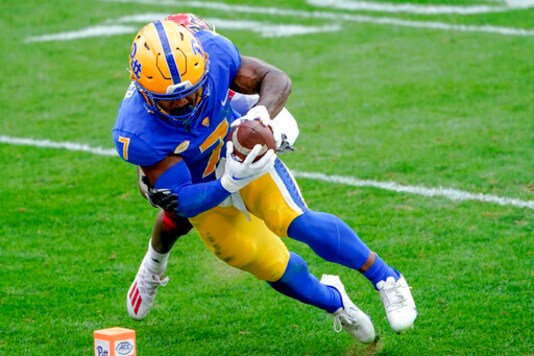 Pittsburgh Panthers wide receiver DJ Turner (7) makes a catch in front of North Carolina State safety Tanner Ingle (10) that set up a Panther touchdown during the second half of an NCAA college football game, Saturday, Oct. 3, 2020, in Pittsburgh. North Carolina State won 30-29. (AP Photo/Keith Srakocic) Pittsburgh Panthers wide receiver DJ Turner (7) makes a catch in front of North Carolina State safety Tanner Ingle (10) that set up a Panther touchdown during the second half of an NCAA college football game, Saturday, Oct. 3, 2020, in Pittsburgh. North Carolina State won 30-29. (AP Photo/Keith Srakocic)