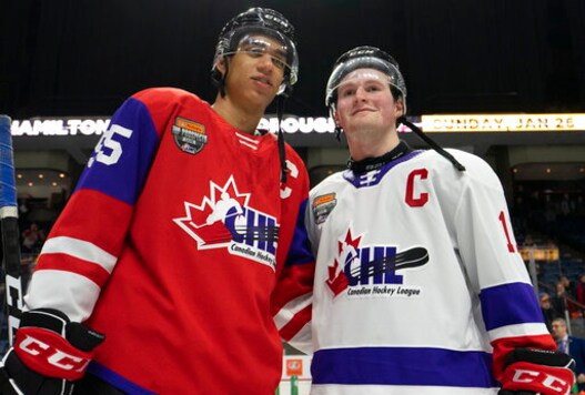 FILE - In this Jan. 16, 2020, file photo, Team Red center Quinton Byfield (55) and Team White left winger Alexis Lafreniere (11) pose for photos following hockey's CHL Top Prospects Game in Hamilton, Ontario. The New York Rangers might be on the clock in owning the No. 1 pick in the NHL draft on Tuesday, Oct. 6. That, and the prospect of selecting Quebec star forward Alexis Lafreniere, doesn't mean the still-retooling Rangers will be anywhere closer to being a contender, team president John Davidson cautions. (Peter Power/The Canadian Press via AP) FILE - In this Jan. 16, 2020, file photo, Team Red center Quinton Byfield (55) and Team White left winger Alexis Lafreniere (11) pose for photos following hockey's CHL Top Prospects Game in Hamilton, Ontario. The New York Rangers might be on the clock in owning the No. 1 pick in the NHL draft on Tuesday, Oct. 6. That, and the prospect of selecting Quebec star forward Alexis Lafreniere, doesn't mean the still-retooling Rangers will be anywhere closer to being a contender, team president John Davidson cautions. (Peter Power/The Canadian Press via AP)