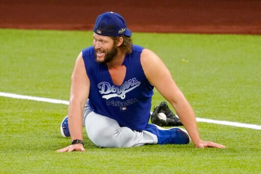 Los Angeles Dodgers starting pitcher Clayton Kershaw works out before Game 3 of a baseball National League Championship Series against the Atlanta Braves Wednesday, Oct. 14, 2020, in Arlington, Texas. (AP Photo/Tony Gutierrez) Los Angeles Dodgers starting pitcher Clayton Kershaw works out before Game 3 of a baseball National League Championship Series against the Atlanta Braves Wednesday, Oct. 14, 2020, in Arlington, Texas. (AP Photo/Tony Gutierrez)
