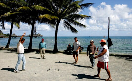 FILE - In this Thursday, Sept. 22, 2005 file photo, locals on the beach in Noumea, New Caledonia, play the traditional ball game FILE - In this Thursday, Sept. 22, 2005 file photo, locals on the beach in Noumea, New Caledonia, play the traditional ball game