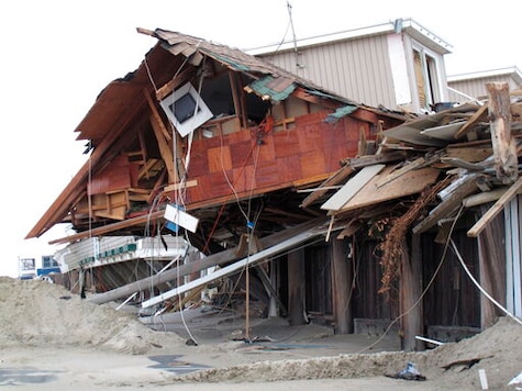 This Nov. 15, 2012 photo shows the remnants of an oceanfront building in Sea Bright N.J. that was destroyed by Superstorm Sandy. On Thursday, Oct. 15, 2020, New Jersey officials released a report committing the state to try to reduce its greenhouse gas emissions by 80% by the year 2050 to help fight climate change and rising sea levels. (AP Photo/Wayne Parry) This Nov. 15, 2012 photo shows the remnants of an oceanfront building in Sea Bright N.J. that was destroyed by Superstorm Sandy. On Thursday, Oct. 15, 2020, New Jersey officials released a report committing the state to try to reduce its greenhouse gas emissions by 80% by the year 2050 to help fight climate change and rising sea levels. (AP Photo/Wayne Parry)