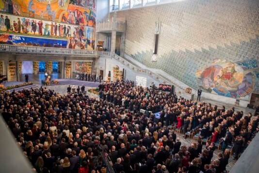 FILE - In this Monday Dec. 10, 2018 file photo, guests attend the Nobel Peace Prize Ceremony in Oslo Town Hall, Oslo. Dr. Denis Mukwege from Congo and Nadia Murad from Iraq will jointly receive the Nobel Peace Prize for their efforts to end the use of sexual violence as a weapon of war and armed conflict. The award ceremony for the 2020 Nobel Peace Prize, traditionally held at the Oslo city hall on Dec. 10, will instead be held in scaled-down form at the citys university because of the coronavirus outbreak. (Berit Roald/NTB Scanpix via AP, File) FILE - In this Monday Dec. 10, 2018 file photo, guests attend the Nobel Peace Prize Ceremony in Oslo Town Hall, Oslo. Dr. Denis Mukwege from Congo and Nadia Murad from Iraq will jointly receive the Nobel Peace Prize for their efforts to end the use of sexual violence as a weapon of war and armed conflict. The award ceremony for the 2020 Nobel Peace Prize, traditionally held at the Oslo city hall on Dec. 10, will instead be held in scaled-down form at the citys university because of the coronavirus outbreak. (Berit Roald/NTB Scanpix via AP, File)