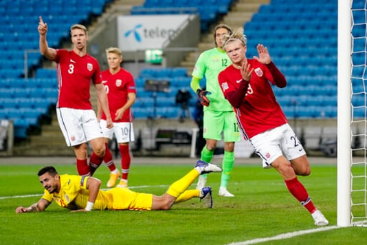 Norway's Erling Braut Haaland, right, celebrates after scoring, during the UEFA Nations League soccer match between Norway and Romania at Ullevaal Stadium, in Oslo, Sunday, Oct. 11, 2020, (Stian Lysberg Solum /NTB scanpix via AP) Norway's Erling Braut Haaland, right, celebrates after scoring, during the UEFA Nations League soccer match between Norway and Romania at Ullevaal Stadium, in Oslo, Sunday, Oct. 11, 2020, (Stian Lysberg Solum /NTB scanpix via AP)