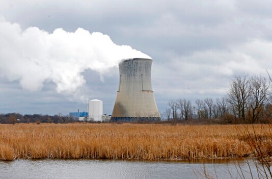 FILE In this April 4, 2017, file photo, is the then-FirstEnergy Corp.'s Davis-Besse Nuclear Power Station in Oak Harbor, Ohio. The committee designated to determine the fate of the legislation that aimed to bailout Ohio's two nuclear plants adjourned Wednesday, Sept. 30, 2020, on the eve of the deadline to replace it before a fee is added to nearly every electricity bill in the state starting Jan 1, 2021. (AP Photo/Ron Schwane, File) FILE In this April 4, 2017, file photo, is the then-FirstEnergy Corp.'s Davis-Besse Nuclear Power Station in Oak Harbor, Ohio. The committee designated to determine the fate of the legislation that aimed to bailout Ohio's two nuclear plants adjourned Wednesday, Sept. 30, 2020, on the eve of the deadline to replace it before a fee is added to nearly every electricity bill in the state starting Jan 1, 2021. (AP Photo/Ron Schwane, File)