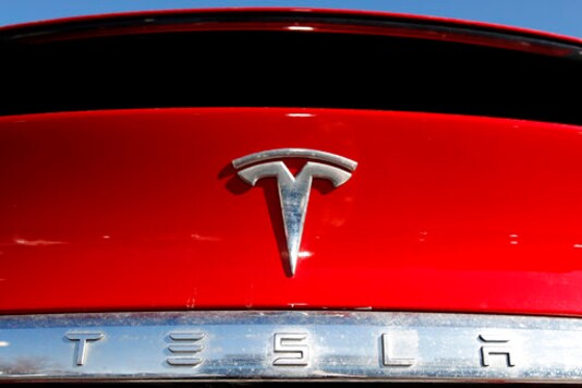 FILE - In this Feb. 2, 2020, file photo, the company logo appears on an unsold 2020 Model X at a Tesla dealership in Littleton, Colo. Investors betting that the stock market will continue to notch gains are increasingly doing so by trading options. The volume of option contracts to buy or sell Microsoft and Tesla shares is up more than twofold from 2019, while Apple option contract volume is up more than 86%.(AP Photo/David Zalubowski, File) FILE - In this Feb. 2, 2020, file photo, the company logo appears on an unsold 2020 Model X at a Tesla dealership in Littleton, Colo. Investors betting that the stock market will continue to notch gains are increasingly doing so by trading options. The volume of option contracts to buy or sell Microsoft and Tesla shares is up more than twofold from 2019, while Apple option contract volume is up more than 86%.(AP Photo/David Zalubowski, File)