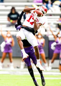 Oklahoma wide receiver Marvin Mims (17) catches a pass as TCU cornerback Kee'yon Stewart (2) defends during the first half of an NCAA College football game, Saturday, Oct. 24, 2020, in Fort Worth, Texas. (AP Photo/Brandon Wade)