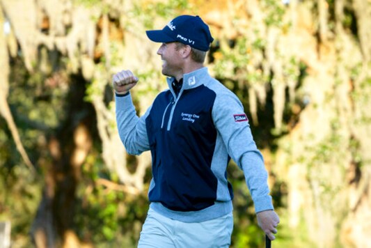 FILE  - In this Nov. 24 2019, file photo, Tyler Duncan pumps his fist after winning a second-hole playoff against Webb Simpson during the final round of the RSM Classic golf tournament in St. Simons Island, Ga. Duncan has had to wait nearly a year to play in the Masters. (AP Photo/Stephen B. Morton, File)