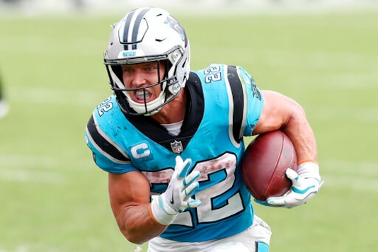 Carolina Panthers running back Christian McCaffrey (22) rushes for a touchdown against the Tampa Bay Buccaneers during the second half of an NFL football game Sunday, Sept. 20, 2020, in Tampa, Fla. The Panthers are eager to get Christian McCaffrey back on the field after he has missed four games with a high ankle sprain. (AP Photo/Mark LoMoglio) Carolina Panthers running back Christian McCaffrey (22) rushes for a touchdown against the Tampa Bay Buccaneers during the second half of an NFL football game Sunday, Sept. 20, 2020, in Tampa, Fla. The Panthers are eager to get Christian McCaffrey back on the field after he has missed four games with a high ankle sprain. (AP Photo/Mark LoMoglio)