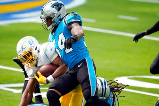 Carolina Panthers outside linebacker Shaq Thompson (54) forces a fumble from Los Angeles Chargers running back Joshua Kelley (27) during the first half of an NFL football game Sunday, Sept. 27, 2020, in Inglewood, Calif. (AP Photo/Alex Gallardo) Carolina Panthers outside linebacker Shaq Thompson (54) forces a fumble from Los Angeles Chargers running back Joshua Kelley (27) during the first half of an NFL football game Sunday, Sept. 27, 2020, in Inglewood, Calif. (AP Photo/Alex Gallardo)