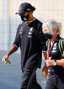 Mercedes driver Lewis Hamilton of Britain, left, walks near the track prior to the Formula One Portuguese Grand Prix at the Algarve International Circuit in Portimao, Portugal, Thursday, Oct. 22, 2020. The Formula One Portuguese Grand Prix will take place on Sunday. (AP Photo/Armando Franca) Mercedes driver Lewis Hamilton of Britain, left, walks near the track prior to the Formula One Portuguese Grand Prix at the Algarve International Circuit in Portimao, Portugal, Thursday, Oct. 22, 2020. The Formula One Portuguese Grand Prix will take place on Sunday. (AP Photo/Armando Franca)