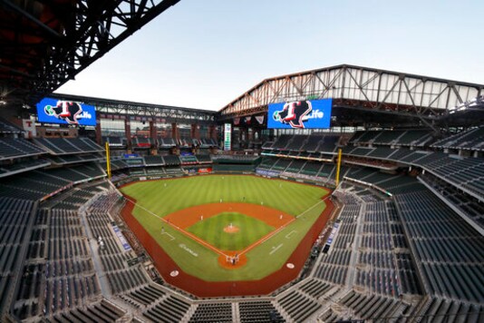 FILE - The Seattle Mariners play the Texas Rangers in the first inning of a baseball game at Globe Life Field in Arlington, Texas, Monday, Aug. 10, 2020. The World Series will be played entirely at the Texas Rangers new ballpark in Arlington, Texas, as part of a bubble agreement between Major League Baseball and the players association, the first time the sports championship will be played entirely at one site since 1944. As part of an agreement finalized Tuesday, Sept. 15, 2020, the Division Series, League Championship Series and World Series will be part of a bubble designed to minimize exposure to the coronavirus. (AP Photo/Tony Gutierrez, File)