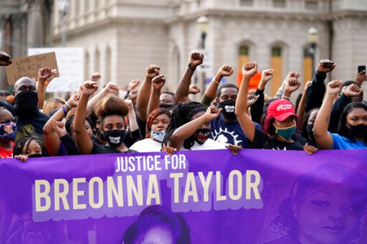 FILE - In this Sept. 25, 2020, file photo, Black Lives Matter protesters march in Louisville. Hours of material in the grand jury proceedings for Taylors fatal shooting by police have been made public on Friday, Oct. 2. (AP Photo/Darron Cummings, File)