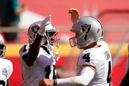 Las Vegas Raiders wide receiver Nelson Agholor, left, celebrates with quarterback Derek Carr after catching a 59-yard touchdown pass during the first half of an NFL football game against the Kansas City Chiefs, Sunday, Oct. 11, 2020, in Kansas City. (AP Photo/Charlie Riedel) Las Vegas Raiders wide receiver Nelson Agholor, left, celebrates with quarterback Derek Carr after catching a 59-yard touchdown pass during the first half of an NFL football game against the Kansas City Chiefs, Sunday, Oct. 11, 2020, in Kansas City. (AP Photo/Charlie Riedel)