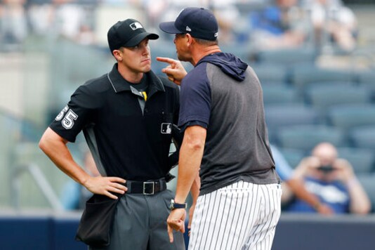 FILE - In this Thursday, July 18, 2019, file photo, New York Yankees' manager Aaron Boone yells at home plate umpire Brennan Miller during the second inning of the first game of a baseball doubleheader against the Tampa Bay Rays in New York. The Rays and Yankees will play in the American League Division Series beginning Monday, Oct. 5, 2020.(AP Photo/Kathy Willens, File) FILE - In this Thursday, July 18, 2019, file photo, New York Yankees' manager Aaron Boone yells at home plate umpire Brennan Miller during the second inning of the first game of a baseball doubleheader against the Tampa Bay Rays in New York. The Rays and Yankees will play in the American League Division Series beginning Monday, Oct. 5, 2020.(AP Photo/Kathy Willens, File)