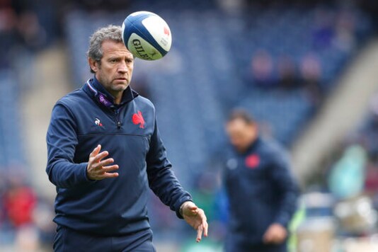 France head coach Fabien Galthie plays a ball during the warm up session prior the Six Nations rugby union international match between Scotland and France at the Murrayfield stadium in Edinburgh, Scotland, Sunday, March 8, 2020. (AP Photo/Scott Heppell)