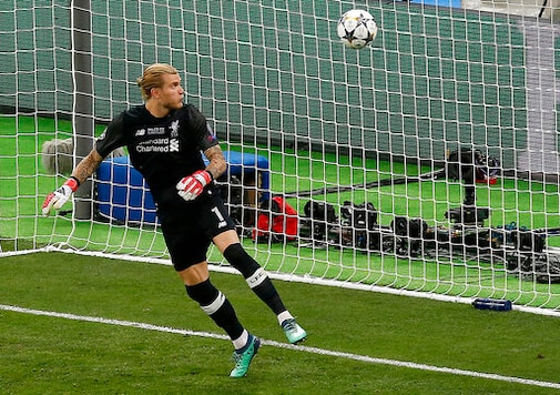FILE - In this Saturday, May 26, 2018 file photo Liverpool goalkeeper Loris Karius looks at the ball after a fumble allowed Real Madrid's Gareth Bale to score his side's 3rd goal during the Champions League Final soccer match between Real Madrid and Liverpool at the Olimpiyskiy Stadium in Kiev, Ukraine. A return to the Bundesliga relegation fight was never part of the plan for Loris Karius. More than two years after high-profile mistakes for Liverpool while concussed in a Champions League final, the German goalkeeper has returned to his homeland for the latest step in trying to to rebuild his once-promising career. (AP Photo/Darko Vojinovic, File) FILE - In this Saturday, May 26, 2018 file photo Liverpool goalkeeper Loris Karius looks at the ball after a fumble allowed Real Madrid's Gareth Bale to score his side's 3rd goal during the Champions League Final soccer match between Real Madrid and Liverpool at the Olimpiyskiy Stadium in Kiev, Ukraine. A return to the Bundesliga relegation fight was never part of the plan for Loris Karius. More than two years after high-profile mistakes for Liverpool while concussed in a Champions League final, the German goalkeeper has returned to his homeland for the latest step in trying to to rebuild his once-promising career. (AP Photo/Darko Vojinovic, File)