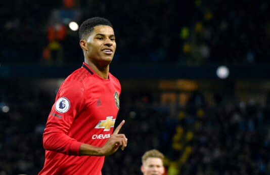 FILE - In this Saturday, Dec. 7, 2019 file photo, Manchester United's Marcus Rashford during their English Premier League soccer match against Manchester City at Etihad stadium in Manchester, England. Rashford has been honored with an MBE by the Queen on Friday, Oct, 9, 2020 for campaigning against child poverty which saw him convince the government to reinstate free meals for vulnerable children. (AP Photo/Rui Vieira, file)