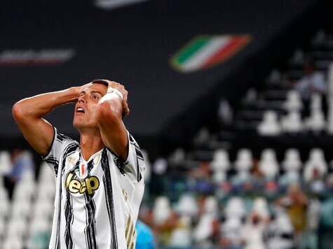FILE - In this Friday, Aug. 7, 2020 file photo Juventus' Cristiano Ronaldo reacts during the Champions League round of 16 second leg, soccer match between Juventus and Lyon at the Allianz stadium in Turin, Italy. The Portuguese soccer federation says Cristiano Ronaldo has tested positive for the coronavirus. The federation says Ronaldo is doing well and has no symptoms. He has been dropped from the country's Nations League match against Sweden on Wednesday. (AP Photo/Antonio Calanni, File)