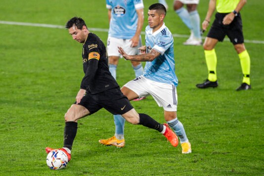 Barcelona's Lionel Messi runs with the ball during the Spanish La Liga soccer match between RC Celta and FC Barcelona in Vigo, Spain, Thursday, Oct. 1, 2020. (AP Photo/Lalo R. Villar)