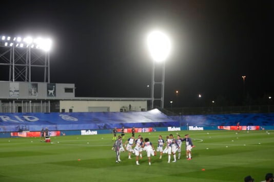 Real Madrid's players warm up prior to the Spanish La Liga soccer match between Real Madrid and Valladolid at Alfredo di Stefano stadium in Madrid, Spain, Wednesday, Sept. 30, 2020. (AP Photo/Manu Fernandez) Real Madrid's players warm up prior to the Spanish La Liga soccer match between Real Madrid and Valladolid at Alfredo di Stefano stadium in Madrid, Spain, Wednesday, Sept. 30, 2020. (AP Photo/Manu Fernandez)