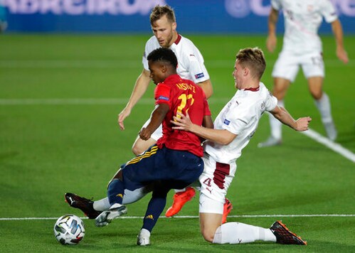 Spain's Ansu Fati, left, attempts a shot on goal as Switzerland's Nico Elvedi goes to block during the UEFA Nations League soccer match between Spain and Switzerland in Madrid, Spain, Saturday, Oct. 10, 2020. (AP Photo/Manu Fernandez) Spain's Ansu Fati, left, attempts a shot on goal as Switzerland's Nico Elvedi goes to block during the UEFA Nations League soccer match between Spain and Switzerland in Madrid, Spain, Saturday, Oct. 10, 2020. (AP Photo/Manu Fernandez)