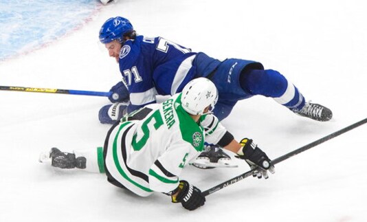 Dallas Stars defenseman Andrej Sekera (5) is checked to the ice by Tampa Bay Lightning center Anthony Cirelli (71) during the second overtime in Game 5 of the NHL hockey Stanley Cup Final, Saturday, Sept. 26, 2020, in Edmonton, Alberta. (Jason Franson/The Canadian Press via AP) Dallas Stars defenseman Andrej Sekera (5) is checked to the ice by Tampa Bay Lightning center Anthony Cirelli (71) during the second overtime in Game 5 of the NHL hockey Stanley Cup Final, Saturday, Sept. 26, 2020, in Edmonton, Alberta. (Jason Franson/The Canadian Press via AP)