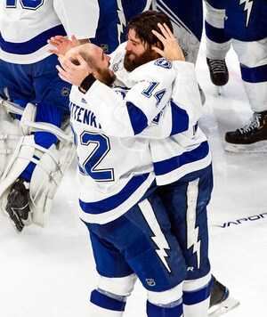 Tampa Bay Lightning's Kevin Shattenkirk (22) and Pat Maroon (14) celebrate after defeating the Dallas Stars to win the Stanley Cup in the NHL Stanley Cup hockey finals, in Edmonton, Alberta, on Monday, Sept. 28, 2020. (Jason Franson/The Canadian Press via AP)