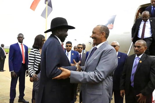 In this October 14, 2019 file photo, provided by the official SUNA news agency, Gen. Abdel-Fattah Burhan, center right, head of Sudan's sovereign council, is greeted by South Sudan's President Salva Kiir, center left. (Image: AP/File) In this October 14, 2019 file photo, provided by the official SUNA news agency, Gen. Abdel-Fattah Burhan, center right, head of Sudan's sovereign council, is greeted by South Sudan's President Salva Kiir, center left. (Image: AP/File)