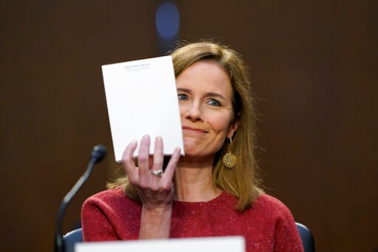 Supreme Court nominee Amy Coney Barrett speaks during a confirmation hearing before the Senate Judiciary Committee, Tuesday, Oct. 13, 2020, on Capitol Hill in Washington. Sen. John Cornyn, R-Texas, asked Barrett what notes she was referring to during the hearing and she held up the blank pad of paper. (AP Photo/Susan Walsh, Pool) Supreme Court nominee Amy Coney Barrett speaks during a confirmation hearing before the Senate Judiciary Committee, Tuesday, Oct. 13, 2020, on Capitol Hill in Washington. Sen. John Cornyn, R-Texas, asked Barrett what notes she was referring to during the hearing and she held up the blank pad of paper. (AP Photo/Susan Walsh, Pool)