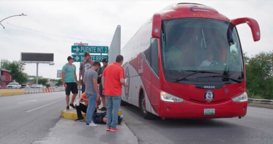 Members of the Tecolotes de los Dos Laredo, a binational professional baseball team with home stadiums in Nuevo Laredo, Mexico, and Laredo, Texas, board a bus in Nuevo Laredo to travel to an away game during the 2019 season in a scene from Members of the Tecolotes de los Dos Laredo, a binational professional baseball team with home stadiums in Nuevo Laredo, Mexico, and Laredo, Texas, board a bus in Nuevo Laredo to travel to an away game during the 2019 season in a scene from