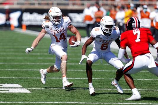 Texas wide receiver Brenden Schooler carries the ball after a reception during the first half of an NCAA college football game against Texas Tech, Saturday Sept. 26, 2020, in Lubbock, Texas. (AP Photo/Mark Rogers) Texas wide receiver Brenden Schooler carries the ball after a reception during the first half of an NCAA college football game against Texas Tech, Saturday Sept. 26, 2020, in Lubbock, Texas. (AP Photo/Mark Rogers)