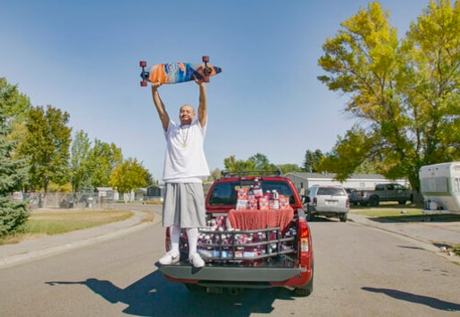 This Oct. 6, 2020 photo released by Ocean Spray shows Nathan Apodaca holding his skateboard while standing in the back of a truck with Ocean Spray products in Idaho Falls, Idaho. Apodaca is enjoying fame from a 22-second TikTok video in which he chugs cranberry juice and sings along to Fleetwood Macs Dreams while cruising down an Idaho highway atop a longboard. The video has racked up 28 million views and counting since he posted it last month. Ocean Spray, whose juice Apodaca is seen swigging in the video, gave him a new truck stocked with juice this week. (Wesley White/Ocean Spray via AP) This Oct. 6, 2020 photo released by Ocean Spray shows Nathan Apodaca holding his skateboard while standing in the back of a truck with Ocean Spray products in Idaho Falls, Idaho. Apodaca is enjoying fame from a 22-second TikTok video in which he chugs cranberry juice and sings along to Fleetwood Macs Dreams while cruising down an Idaho highway atop a longboard. The video has racked up 28 million views and counting since he posted it last month. Ocean Spray, whose juice Apodaca is seen swigging in the video, gave him a new truck stocked with juice this week. (Wesley White/Ocean Spray via AP)