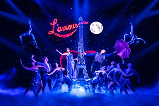 This image released by Boneau/Bryan-Brown shows Aaron Tveit, center right, and Karen Olivo, center left, during a performance of the musical This image released by Boneau/Bryan-Brown shows Aaron Tveit, center right, and Karen Olivo, center left, during a performance of the musical