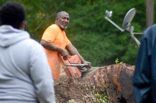 Carey Blackmon cuts an oak tree after it fell on the home of Larry Veal, Saturday, Oct. 10, 2020, in Gloster, Miss., during Hurricane Delta. (Matt Williamson/The Enterprise-Journal via AP) Carey Blackmon cuts an oak tree after it fell on the home of Larry Veal, Saturday, Oct. 10, 2020, in Gloster, Miss., during Hurricane Delta. (Matt Williamson/The Enterprise-Journal via AP)