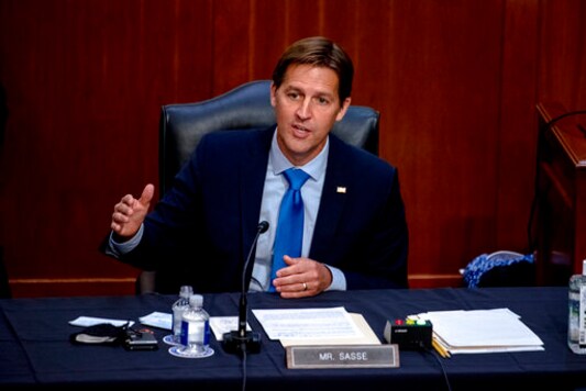 FILE - In this Oct. 14, 2020 file photo, Sen. Ben Sasse, R-Neb., speaks during the confirmation hearing for Supreme Court nominee Amy Coney Barrett, before the Senate Judiciary Committee on Capitol Hill in Washington. Sen. Sasse told constituents in a telephone town hall meeting that President Donald Trump has flirted with white supremacists, mocks Christian evangelicals in private, and kisses dictators' butts. (Hilary Swift/The New York Times via AP, Pool, File) FILE - In this Oct. 14, 2020 file photo, Sen. Ben Sasse, R-Neb., speaks during the confirmation hearing for Supreme Court nominee Amy Coney Barrett, before the Senate Judiciary Committee on Capitol Hill in Washington. Sen. Sasse told constituents in a telephone town hall meeting that President Donald Trump has flirted with white supremacists, mocks Christian evangelicals in private, and kisses dictators' butts. (Hilary Swift/The New York Times via AP, Pool, File)