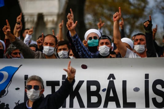 Demonstrators chant slogans during an anti-France protest in Istanbul, Sunday, Oct. 25, 2020. Turkish President Recep Tayyip Erdogan on Sunday challenged the United States to impose sanctions against his country while also launching a second attack on French President Emmanuel Macron. Speaking a day after he suggested Macron needed mental health treatment because of his attitude to Islam and Muslims, which prompted France to recall its ambassador to Ankara, Erdogan took aim at foreign critics. (AP Photo/Emrah Gurel) Demonstrators chant slogans during an anti-France protest in Istanbul, Sunday, Oct. 25, 2020. Turkish President Recep Tayyip Erdogan on Sunday challenged the United States to impose sanctions against his country while also launching a second attack on French President Emmanuel Macron. Speaking a day after he suggested Macron needed mental health treatment because of his attitude to Islam and Muslims, which prompted France to recall its ambassador to Ankara, Erdogan took aim at foreign critics. (AP Photo/Emrah Gurel)