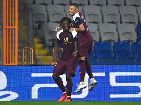 PSG's Kylian Mbappe, right, congratulates his teammate Moise Kean, left, after he scored during the Champions League group H soccer match between Basaksehir and Paris Saint Germain in Istanbul, Wednesday, Oct. 28, 2020. Paris Saint Germain won the match 2-0. (Ozan Kose/Pool via AP) PSG's Kylian Mbappe, right, congratulates his teammate Moise Kean, left, after he scored during the Champions League group H soccer match between Basaksehir and Paris Saint Germain in Istanbul, Wednesday, Oct. 28, 2020. Paris Saint Germain won the match 2-0. (Ozan Kose/Pool via AP)