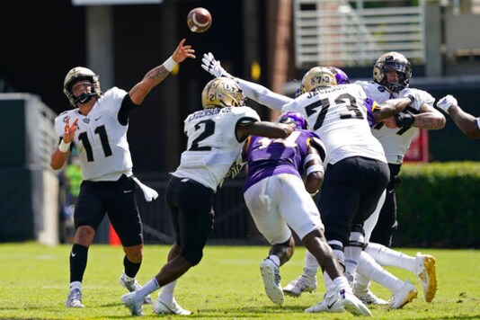 Central Florida quarterback Dillon Gabriel (11) passes against East Carolina during the first half of an NCAA college football game in Greenville, N.C., Saturday, Sept. 26, 2020. (AP Photo/Gerry Broome)