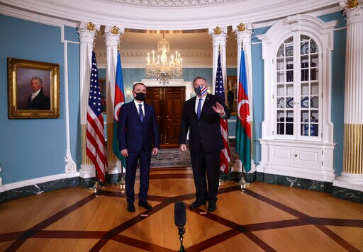 Secretary of State Mike Pompeo acknowledges members of the news media with Armenia's Foreign Minister Zohrab Mnatsakanyan, prior to holding talks, Friday, Oct. 23, 2020 at the State Department in Washington. (Hannah McKay/Poolvia AP)