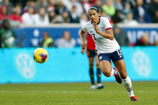 FILE - In this March 8, 2020, file photo, United States forward Lynn Williams (13) chases after the ball during the second half of a SheBelieves Cup soccer match against Spain in Harrison, N.J. Williams had her momentum with the U.S. national team stalled by the coronavirus pandemic. She was hoping to earn a spot on the Olympic team this past summer. But the one-year delay has given her time to work on different aspects of her game. (AP Photo/Steve Luciano, File)
