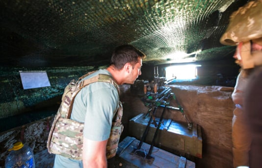 FILE In this file photo taken on Thursday, Aug. 6, 2020, Ukrainian President Volodymyr Zelenskiy looks through an embrasure as he visits the war-hit Donetsk region, eastern Ukraine. Ukrainians are heading to the polls on Sunday, Oct. 25, 2020 to cast ballots in local elections seen as a key test for President Volodymyr Zelenskiy. Zelenskiy, a popular comedian without prior political experience, was elected by a landslide in April 2019 on promises to end fighting with Russia-backed separatists in eastern Ukraine, uproot endemic corruption and shore up a worsening economy. (Ukrainian Presidential Press Office via AP, File) FILE In this file photo taken on Thursday, Aug. 6, 2020, Ukrainian President Volodymyr Zelenskiy looks through an embrasure as he visits the war-hit Donetsk region, eastern Ukraine. Ukrainians are heading to the polls on Sunday, Oct. 25, 2020 to cast ballots in local elections seen as a key test for President Volodymyr Zelenskiy. Zelenskiy, a popular comedian without prior political experience, was elected by a landslide in April 2019 on promises to end fighting with Russia-backed separatists in eastern Ukraine, uproot endemic corruption and shore up a worsening economy. (Ukrainian Presidential Press Office via AP, File)