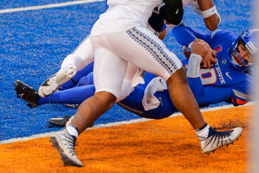 Boise State quarterback Hank Bachmeier (19) dives into the end zone on a 6 yard touchdown run against Utah State in the first half of an NCAA college football game Saturday, Oct. 24, 2020, in Boise, Idaho. Boise State won 42-13. (AP Photo/Steve Conner) Boise State quarterback Hank Bachmeier (19) dives into the end zone on a 6 yard touchdown run against Utah State in the first half of an NCAA college football game Saturday, Oct. 24, 2020, in Boise, Idaho. Boise State won 42-13. (AP Photo/Steve Conner)
