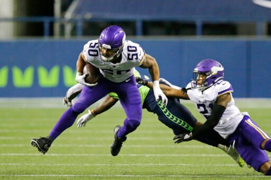 Minnesota Vikings linebacker Eric Wilson (50) returns an interception against the Seattle Seahawks during the second half of an NFL football game, Sunday, Oct. 11, 2020, in Seattle. (AP Photo/John Froschauer) Minnesota Vikings linebacker Eric Wilson (50) returns an interception against the Seattle Seahawks during the second half of an NFL football game, Sunday, Oct. 11, 2020, in Seattle. (AP Photo/John Froschauer)