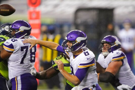 Minnesota Vikings quarterback Kirk Cousins throws against the Seattle Seahawks during the second half of an NFL football game, Sunday, Oct. 11, 2020, in Seattle. (AP Photo/Ted S. Warren)